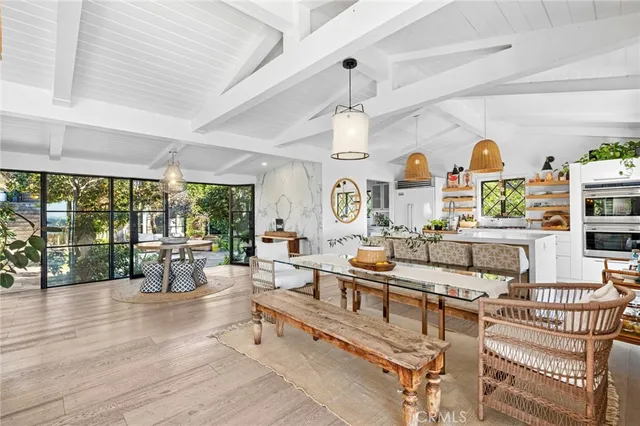a living room with furniture a rug and a chandelier