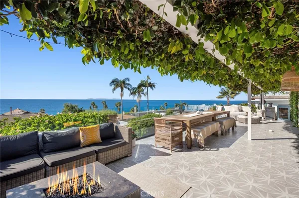a view of a patio with couches and potted plants