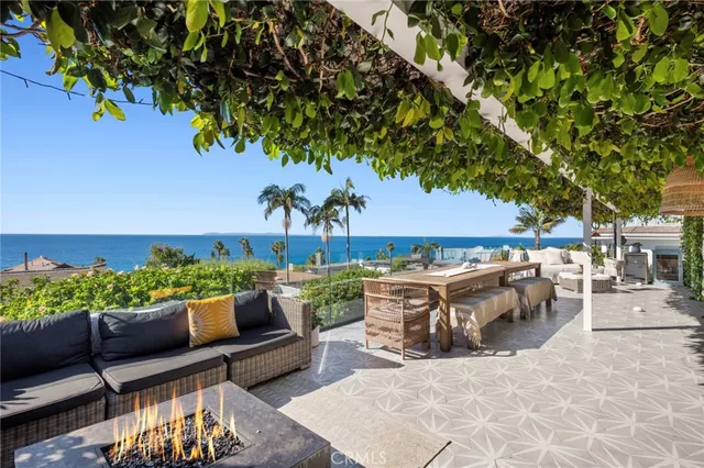 a view of a patio with couches and potted plants