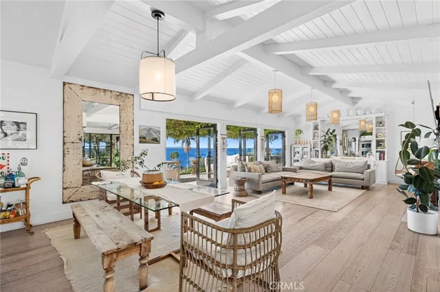 a living room with fireplace furniture and a chandelier