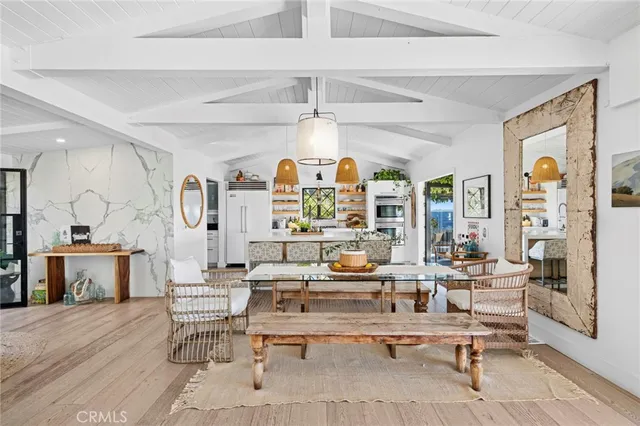 a living room with fireplace furniture and a large window