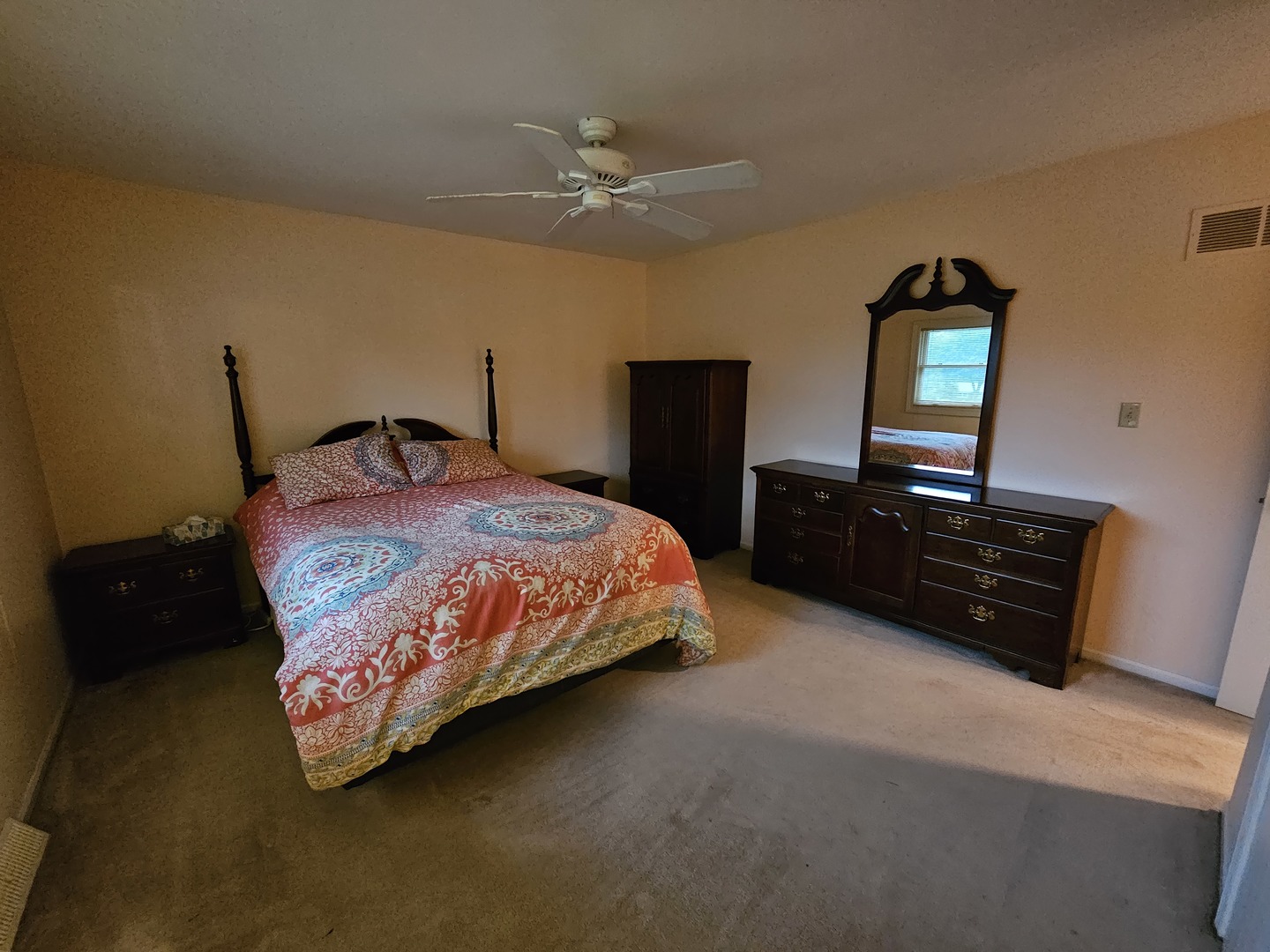 7N715 Sycamore Road St. Charles, IL 60175 - Photo 17 of 20 a bedroom with a bed and dresser with mirror