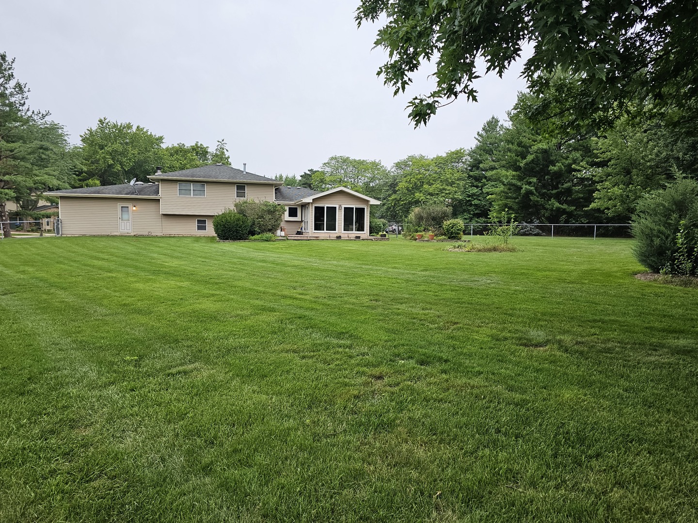 7N715 Sycamore Road St. Charles, IL 60175 - Photo 7 of 20 a front view of a house with a garden