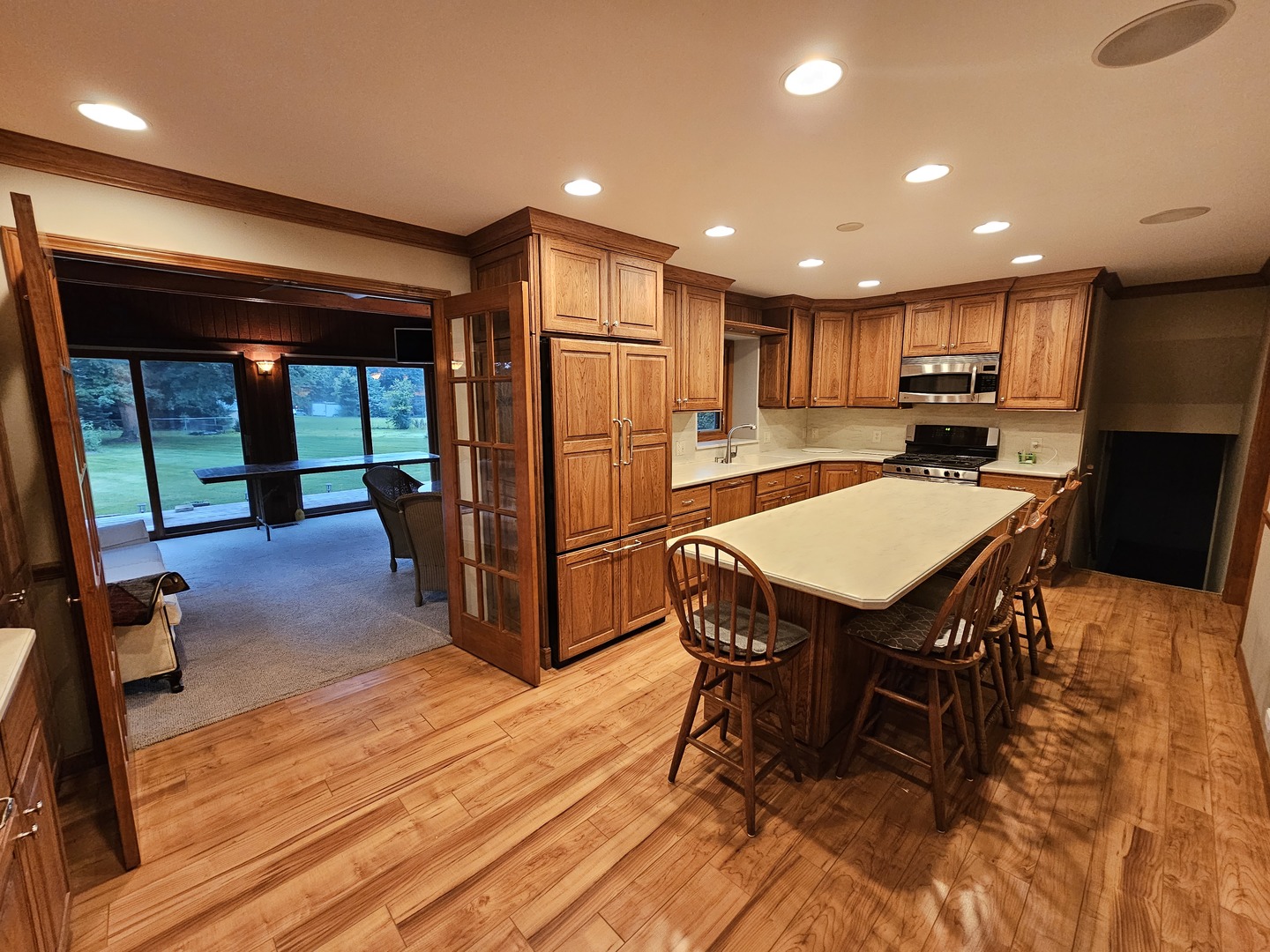 7N715 Sycamore Road St. Charles, IL 60175 - Photo 10 of 20 an open kitchen with dining table and chairs