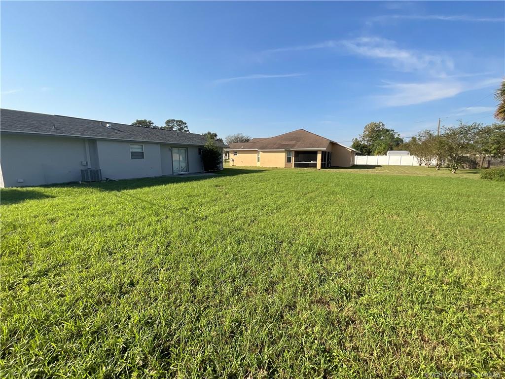941 Southwest Fenway Road Port St. Lucie, FL 34953 - Photo 2 of 15 a house view with a garden space