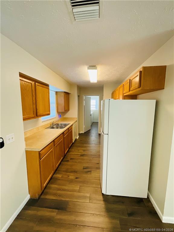 941 Southwest Fenway Road Port St. Lucie, FL 34953 - Photo 5 of 15 a view of kitchen with stainless steel appliances granite countertop a refrigerator and a stove