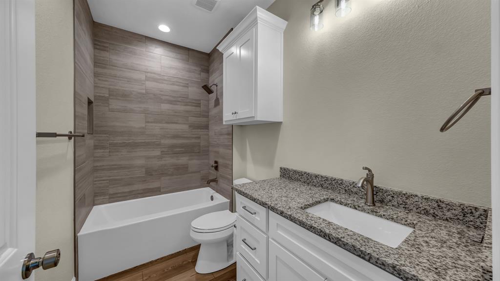 3451 Eleanor Tbd County Road Paradise, TX 76073 - Photo 21 of 25 a bathroom with a granite countertop sink toilet and shower