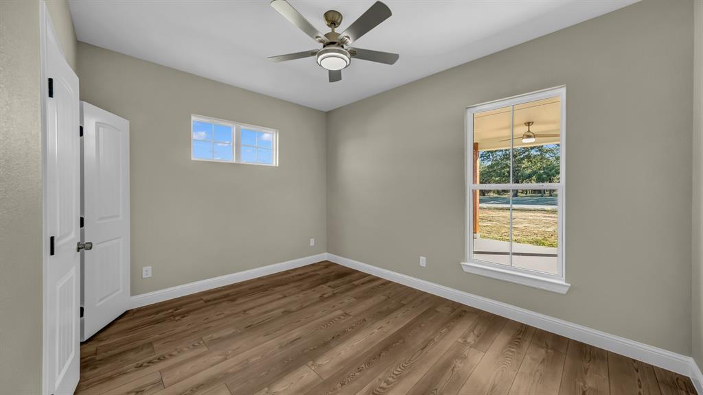 3451 Eleanor Tbd County Road Paradise, TX 76073 - Photo 22 of 25 a view of a big room with wooden floor and windows