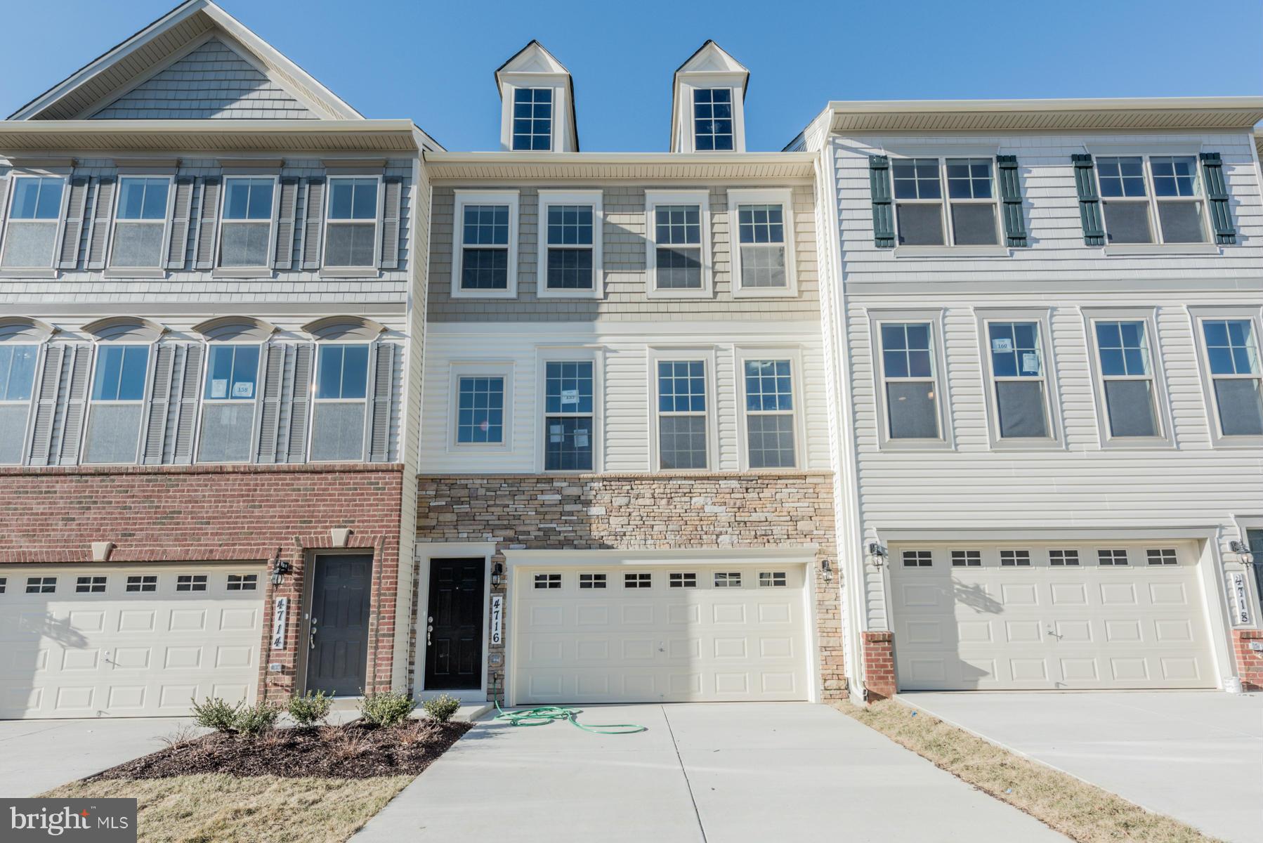 4716 Cambria Road Frederick, MD 21703 - Photo 1 of 27 a front view of a building with a parking space