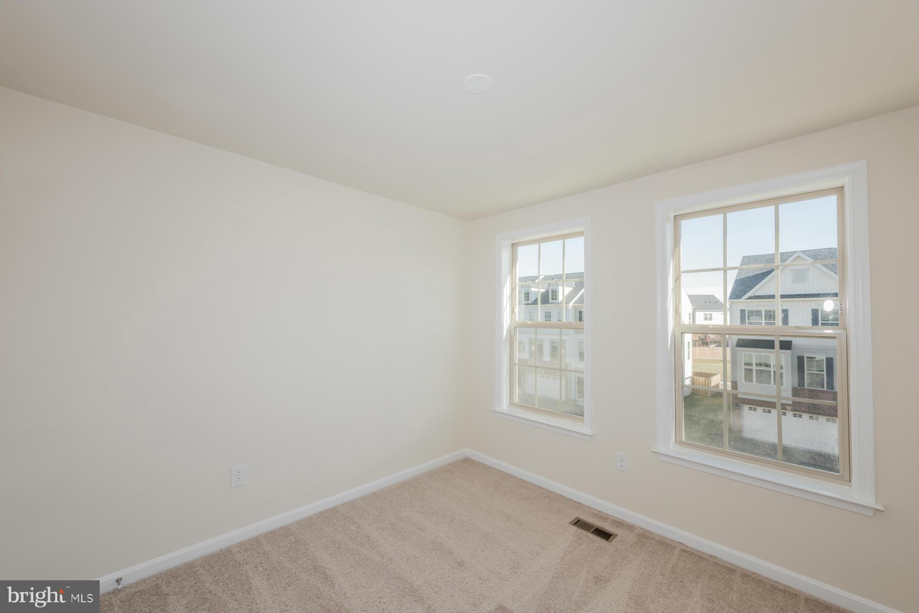 4716 Cambria Road Frederick, MD 21703 - Photo 14 of 27 an empty room with windows