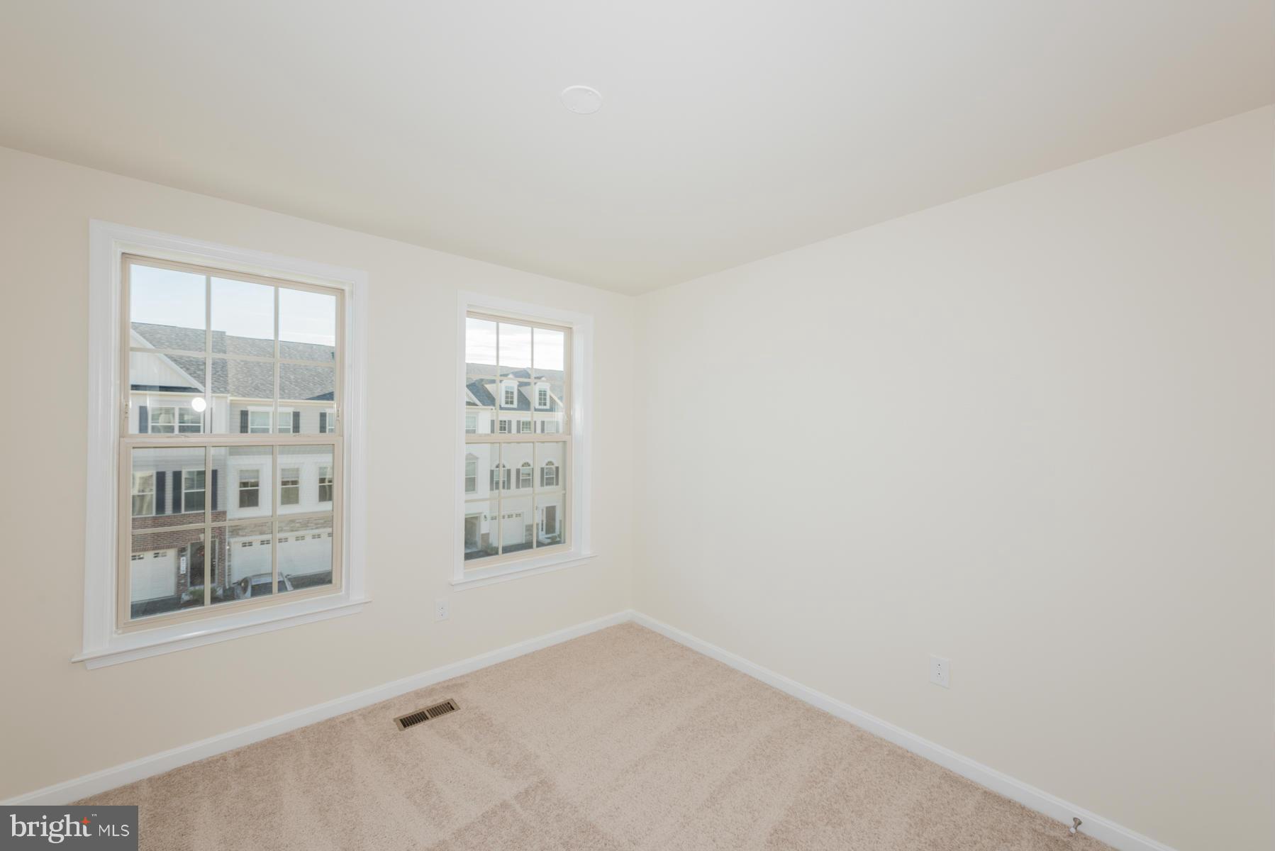 4716 Cambria Road Frederick, MD 21703 - Photo 16 of 27 an empty room with windows