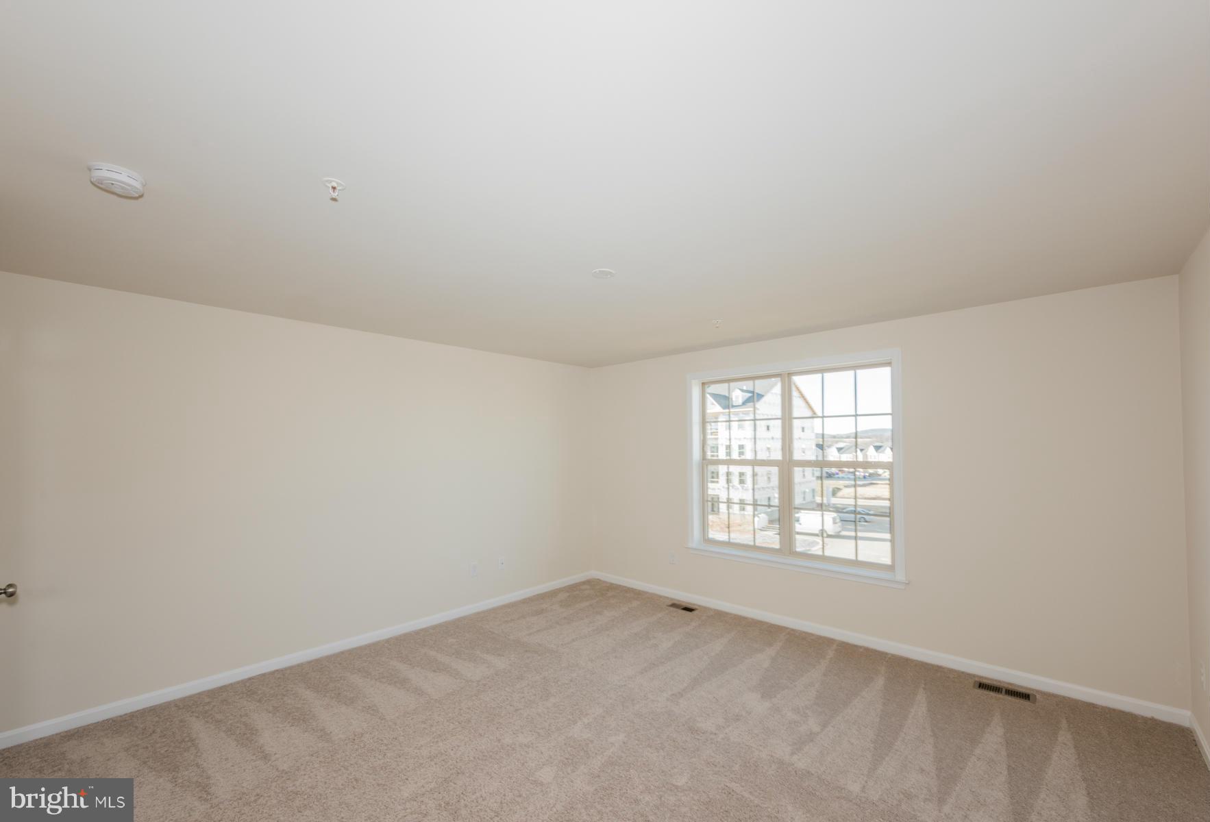 4716 Cambria Road Frederick, MD 21703 - Photo 19 of 27 an empty room with windows