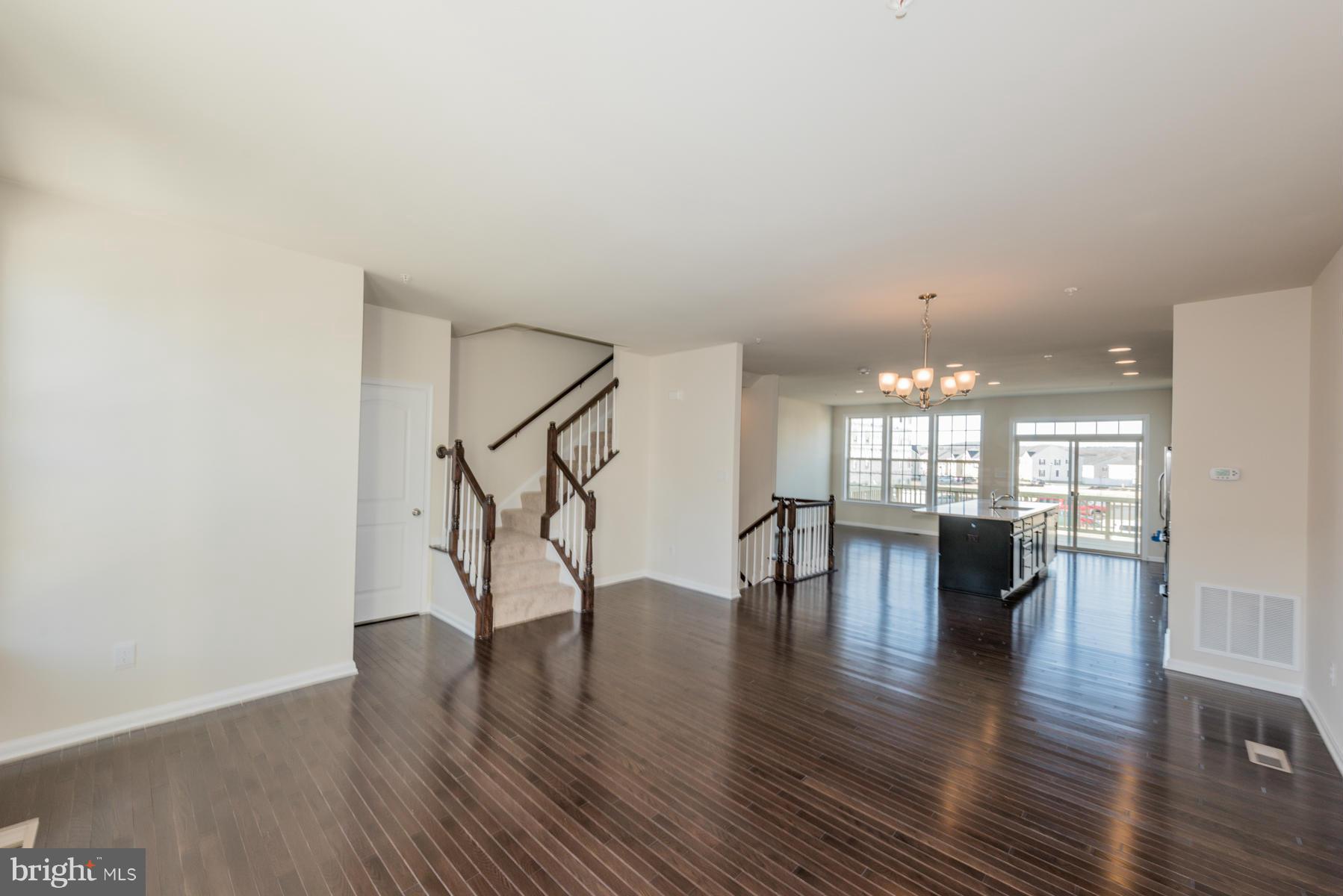4716 Cambria Road Frederick, MD 21703 - Photo 4 of 27 a view of dining room with furniture and wooden floor