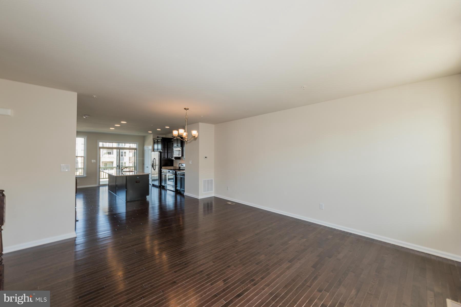 4716 Cambria Road Frederick, MD 21703 - Photo 5 of 27 a view of empty room with wooden floor