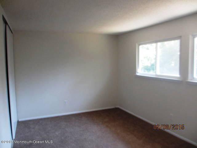 13 Anchor Road Barnegat, NJ 08005 - Photo 5 of 6 an empty room with a window