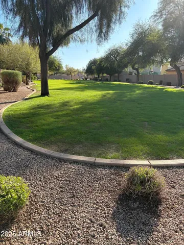 a view of a golf course with a trees