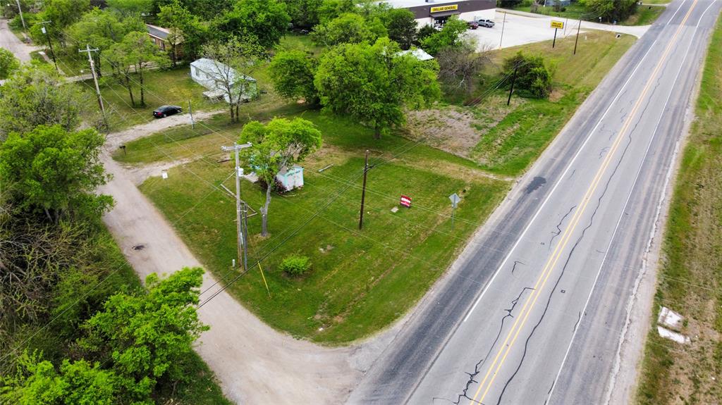 101 Wallace Street Lone Oak, TX 75453 - Photo 4 of 11 a view of a lot of flower plants with a lake view