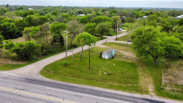 a view of a back yard from a balcony
