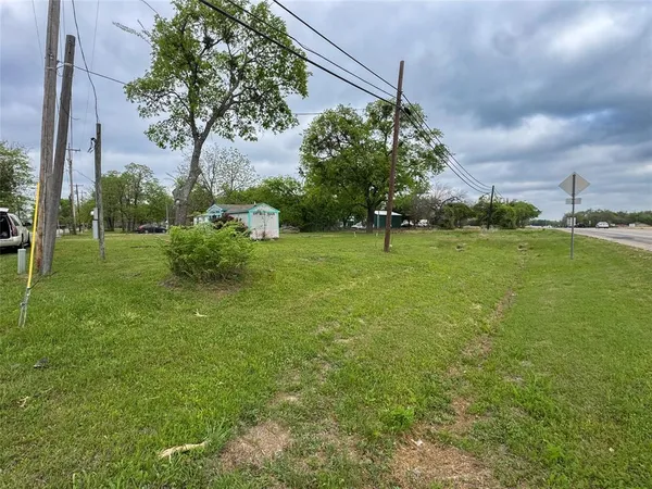 a view of a golf course with a big yard
