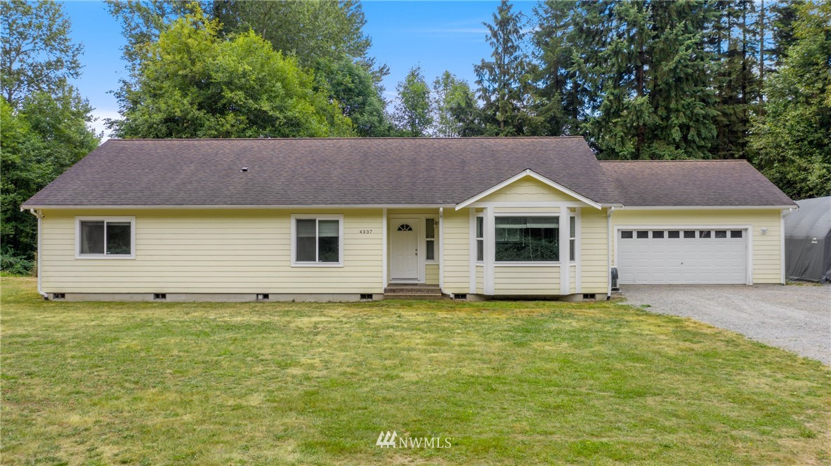 4337 Maytown Road Southwest Olympia, WA 98512 - Photo 1 of 30 a view of a house with a garden and yard