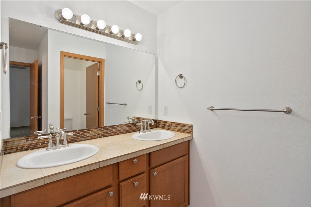 4337 Maytown Road Southwest Olympia, WA 98512 - Photo 18 of 30 a bathroom with a sink and a mirror