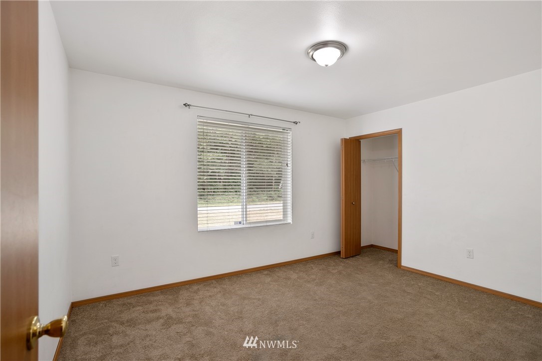 4337 Maytown Road Southwest Olympia, WA 98512 - Photo 21 of 30 an empty room with a window