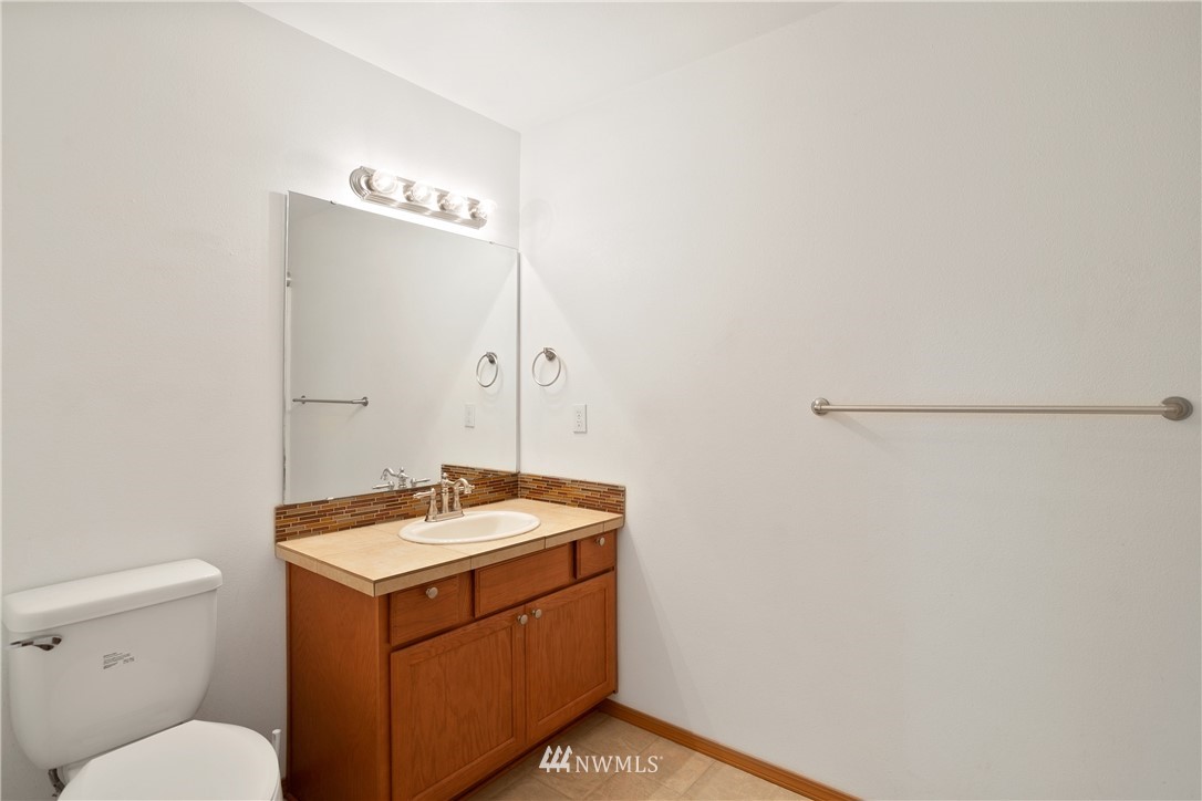 4337 Maytown Road Southwest Olympia, WA 98512 - Photo 25 of 30 a bathroom with a sink a toilet and a mirror