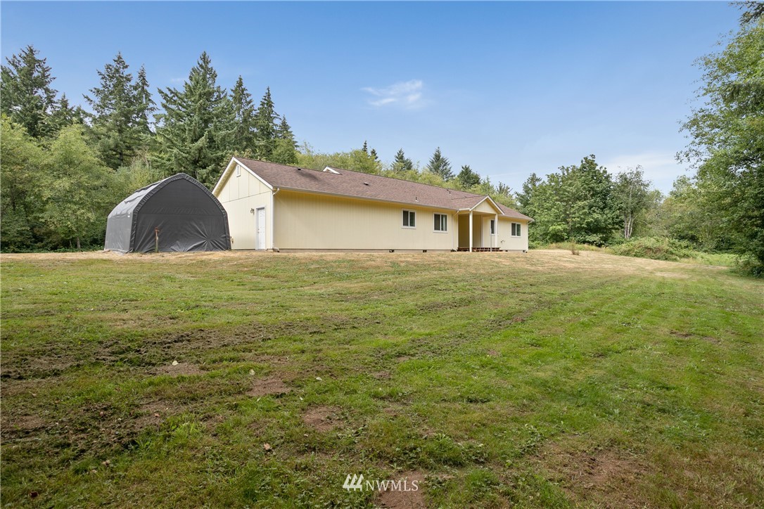 4337 Maytown Road Southwest Olympia, WA 98512 - Photo 29 of 30 a view of a house with a yard and a garage