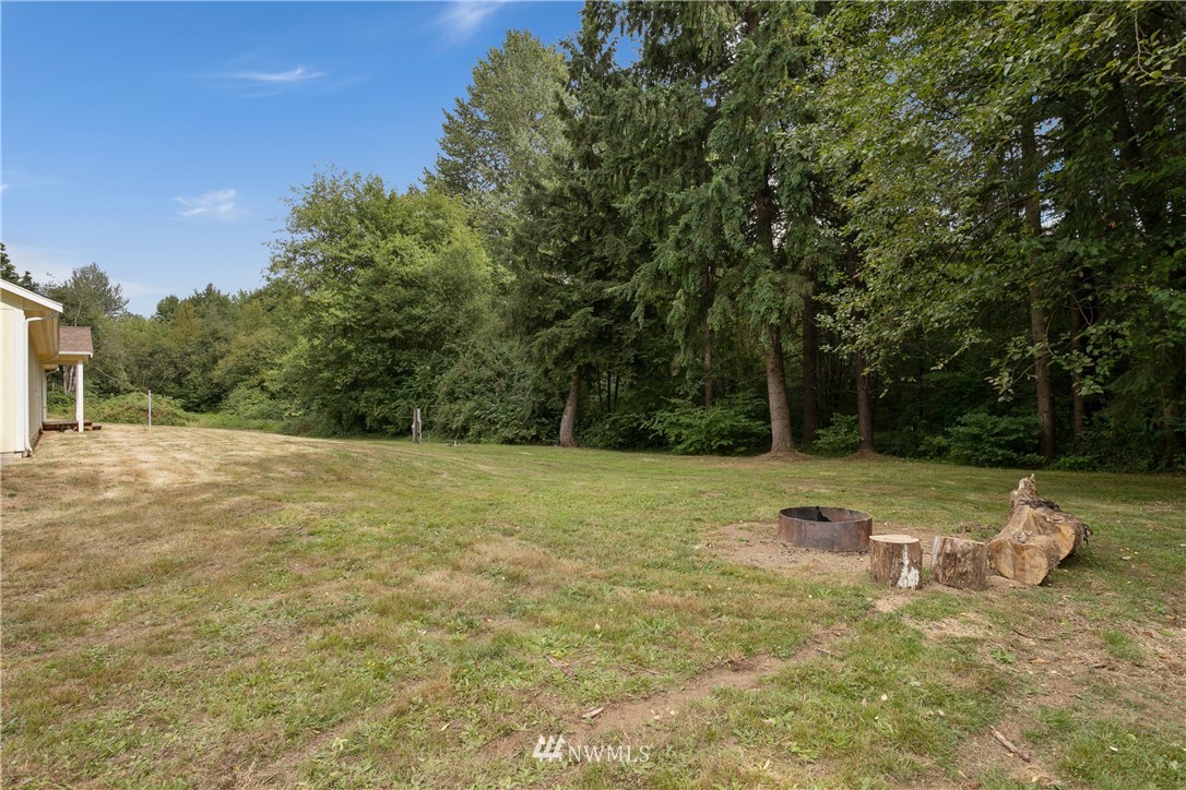 4337 Maytown Road Southwest Olympia, WA 98512 - Photo 6 of 30 a backyard of a house with trees