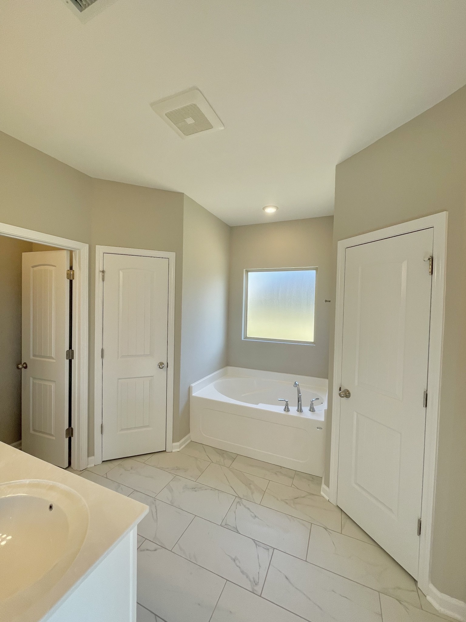 704 Rex Dr Spring Hill Spring Hill, TN 37174 - Photo 16 of 21 a spacious bathroom with a bathtub and a shower