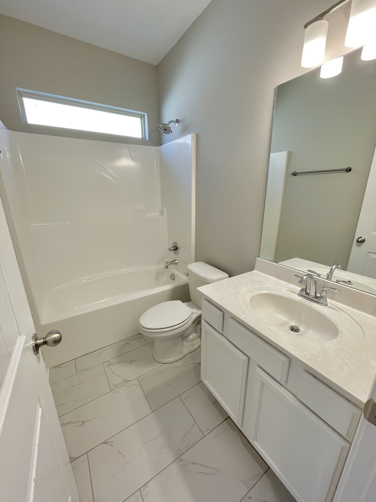 704 Rex Dr Spring Hill Spring Hill, TN 37174 - Photo 5 of 21 a bathroom with a double vanity sink toilet mirror and shower