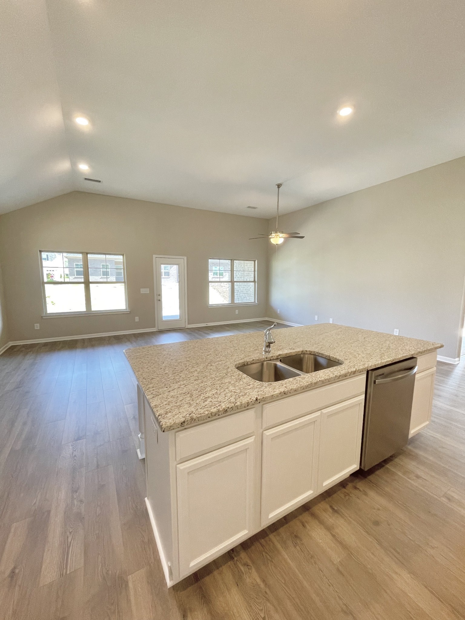 704 Rex Dr Spring Hill Spring Hill, TN 37174 - Photo 9 of 21 a kitchen with a stove and white cabinets