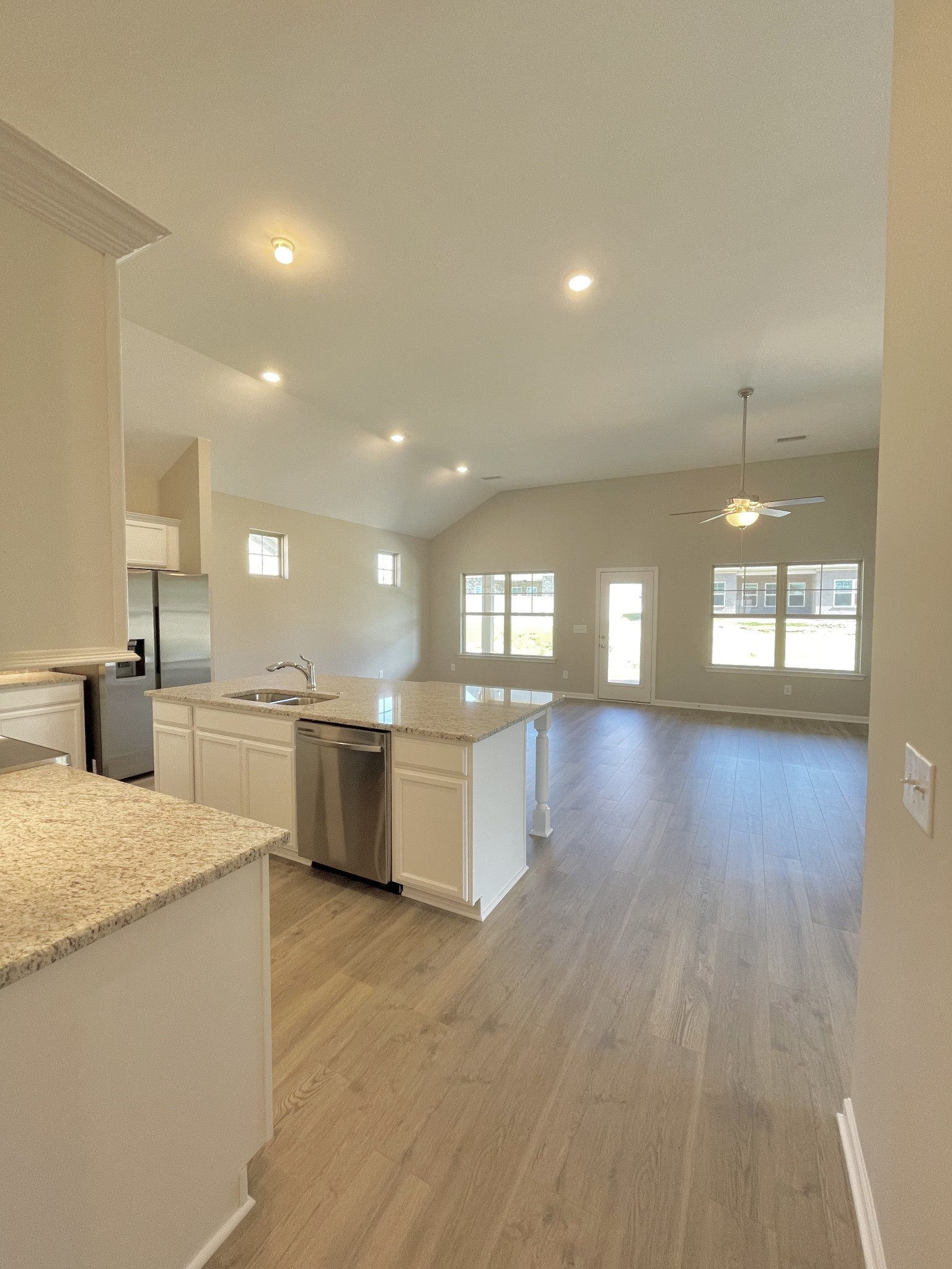 704 Rex Dr Spring Hill Spring Hill, TN 37174 - Photo 10 of 21 a large kitchen with a large counter top a sink a window and stainless steel appliances