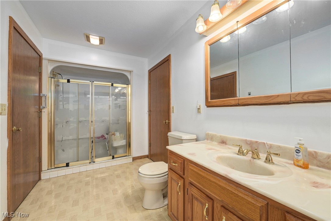 1140 West River Road Vermilion, OH 44089 - Photo 25 of 49 Full bath featuring a shower stall and vanity