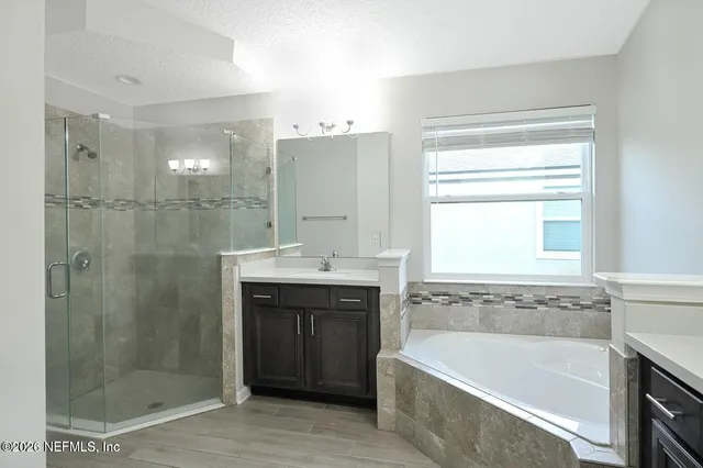 a bathroom with a bathtub and a sink