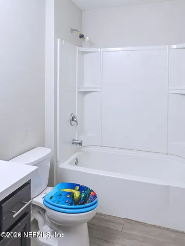 a bathroom with a sink a toilet and a bathtub