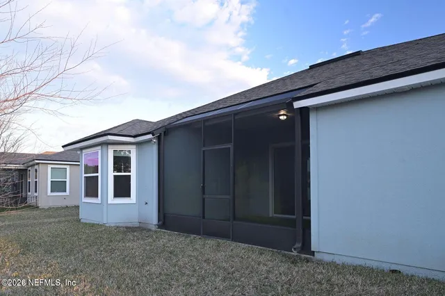 a backyard of a house with lots of green space