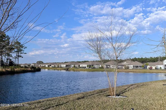 a white building with a clock on the side of it