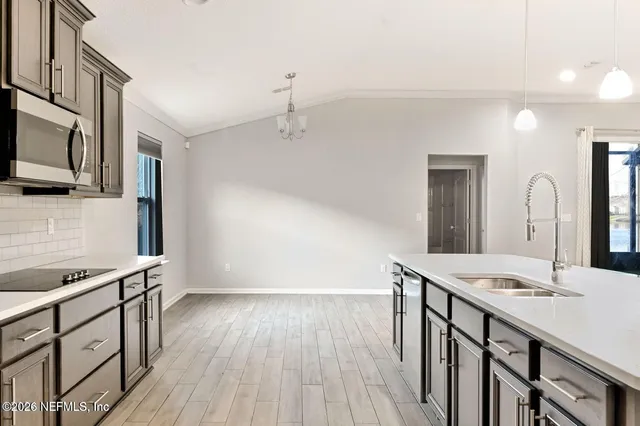 a bathroom with a sink double vanity granite tub and a mirror
