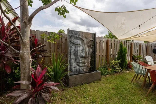 a view of outdoor space with seating area and trees