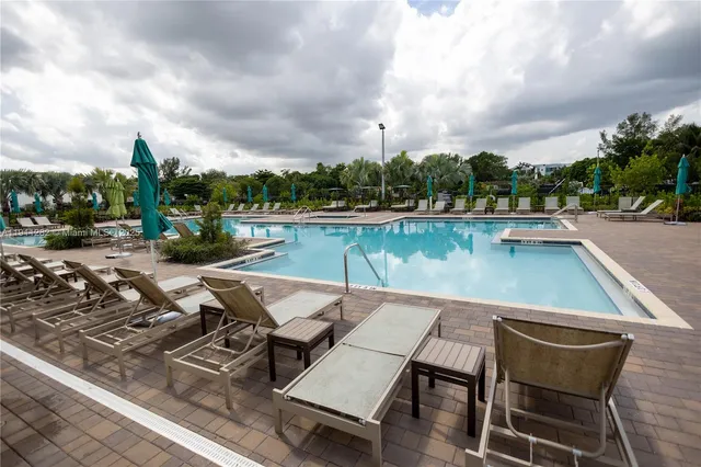 an outdoor sitting area with furniture