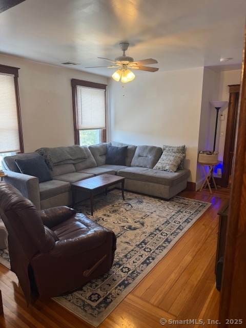 18 Walnut Street Bristol, CT 06010 - Photo 3 of 13 a living room with furniture and a flat screen tv