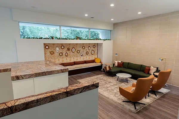 a kitchen with a sink a counter space and living room