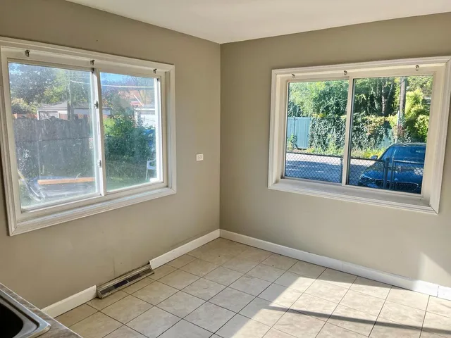 a view of a room that has a window in it