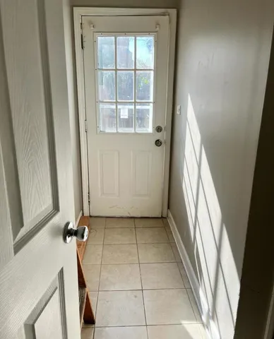 a view of entryway with wooden floor
