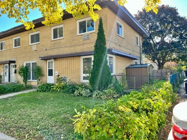a view of a house with garden and yard