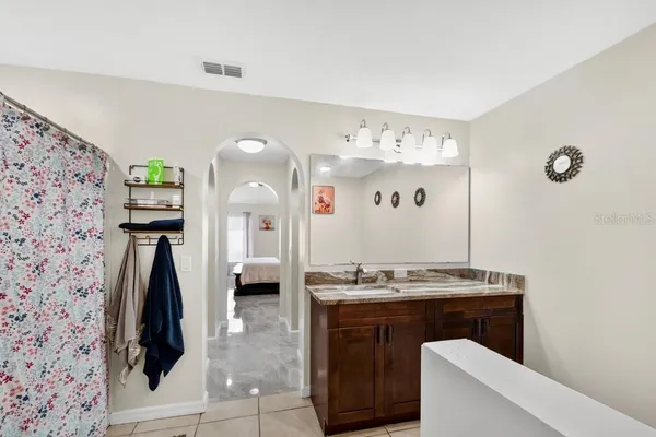 a bathroom with a sink and mirror