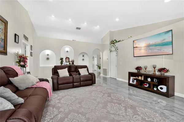 a living room with furniture and a large window