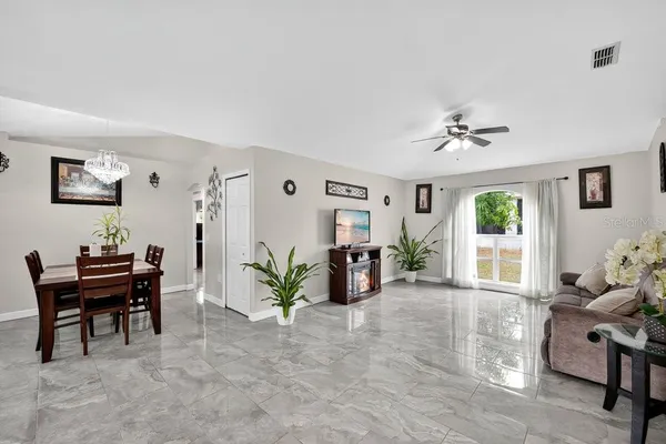 a living room with furniture and a window