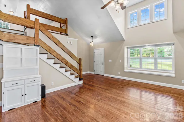 a view of an entryway with wooden floor and stairs